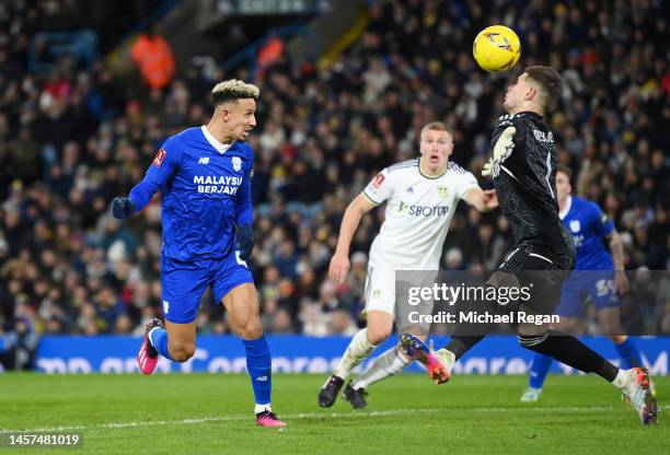 Callum Robinson of Cardiff City scores the team's first goal as Illan Meslier of Leeds United attempts to make a save during the Emirates FA Cup...