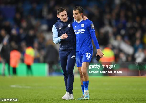 Dean Whitehead, Interim Manager of Cardiff City, speaks with Tom Sang after the Emirates FA Cup Third Round Replay match between Leeds United and...