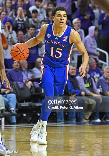 Kevin McCullar Jr. #15 of the Kansas Jayhawks dribbles the ball up court in the first half against the Kansas State Wildcats at Bramlage Coliseum on...