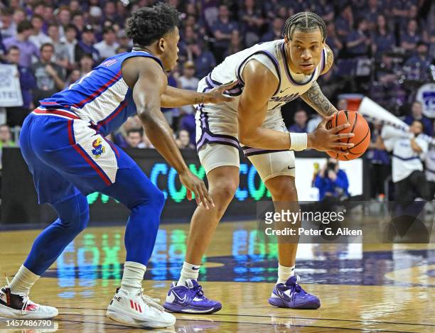 Keyontae Johnson of the Kansas State Wildcats goes up against Joseph Yesufu of the Kansas Jayhawks in the second half at Bramlage Coliseum on January...