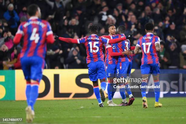 Michael Olise of Crystal Palace celebrates after scoring the team's first goal from a free kick with teammates during the Premier League match...