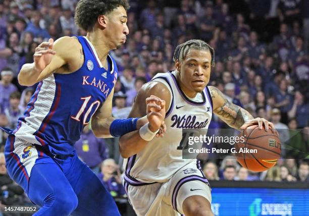 Keyontae Johnson of the Kansas State Wildcats drives with the ball against Jalen Wilson of the Kansas Jayhawks in the second half at Bramlage...