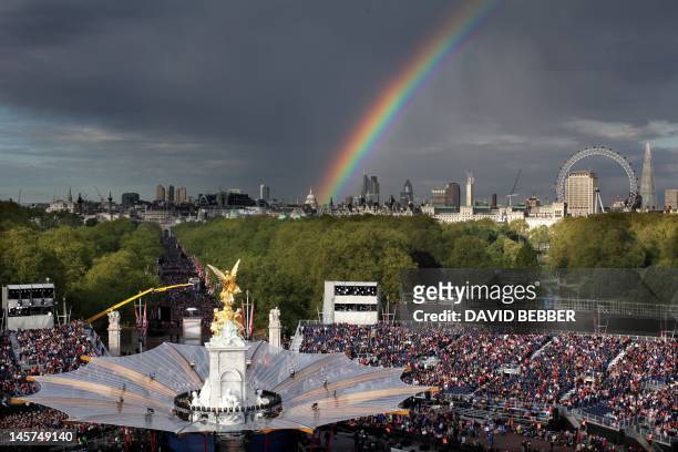 Rainbow is seen over London Eye and the stage of the The Diamond Jubilee Concert outside Buckingham Palace in London, on June 4, 20112. A chain of...
