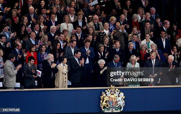 Britain's Queen Elizabeth II waves from the Royal Box surrounded by guests including members of the royal family, clergy and members of the British...