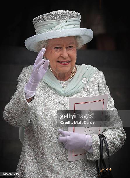 Queen Elizabeth II waves as she leaves a Service Of Thanksgiving at St Paul's Cathedral on June 5, 2012 in London, England. For only the second time...
