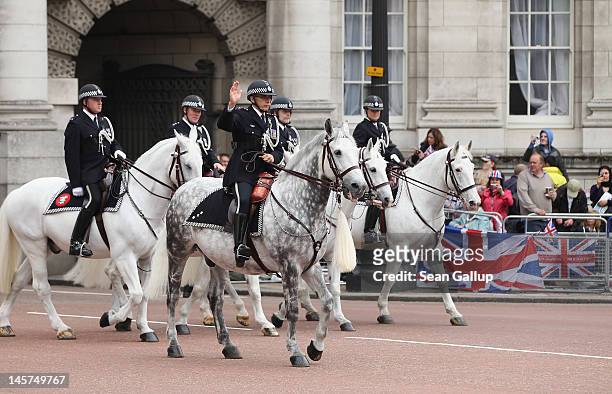 Police mounted on horses ride along the royal procession route during the Diamond Jubilee on June 5, 2012 in London, England. For only the second...