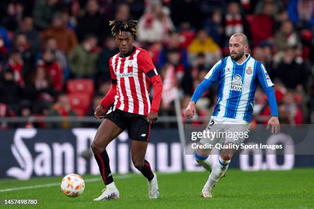 Nico Williams of Athletic Club compete for the ball with Aleix Vidal of RCD Espanyol during the Copa del Rey Round of 16 match between Athletic Club...