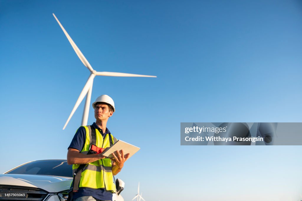 Renewable Energy Systems. Electricity Maintenance Engineer working on the field at a Wind Turbine