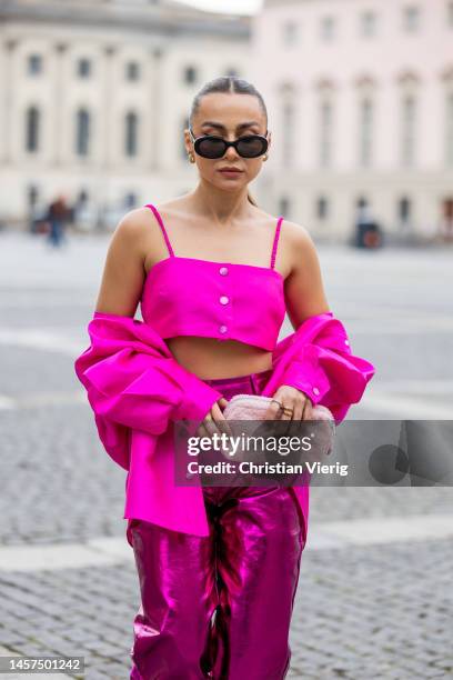 Anna Idriess wears pink cropped top & button shirt Sandro Paris, pants Amy Lynn, heels Marc cain, sunglasses Celine during the Berlin Fashion Week...