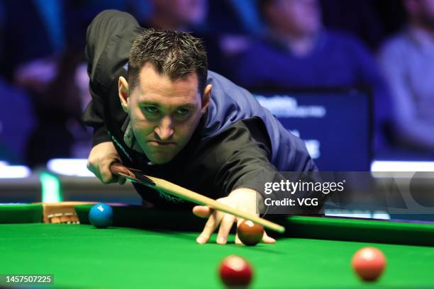 Tom Ford of England plays a shot during the first round match against Sam Craigie of England on day three of the 2023 Duelbits World Grand Prix at...