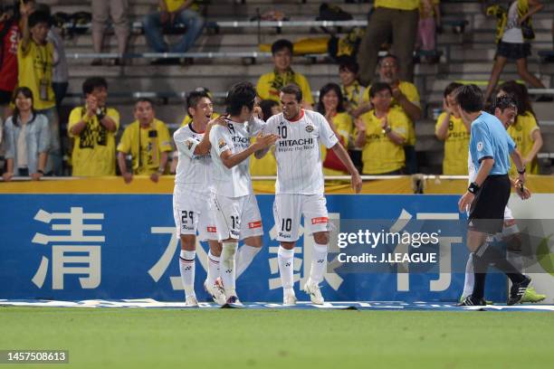 Masato Kudo of Kashiwa Reysol celebrates with teammates Leandro Domingues and Koki Mizuno after scoring the team's fifth goal during the J.League J1...