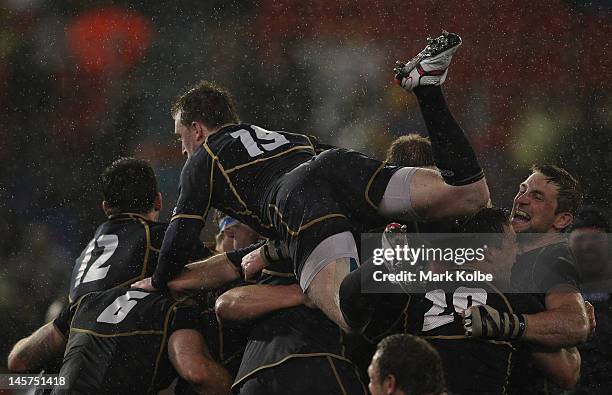 Stuart Hogg of Scotland celebrates with his team mates after their victory during the International Test match between the Australian Wallabies and...