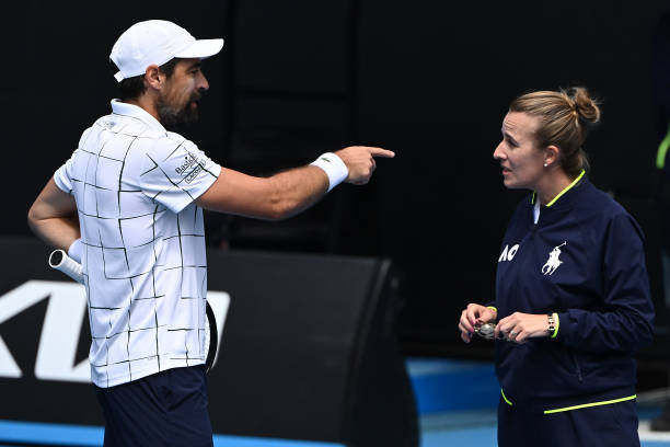 Jeremy Chardy of France speaks to chair umpire Miriam Bley in their round two singles match against Daniel Evans of Great Britain during day four of...