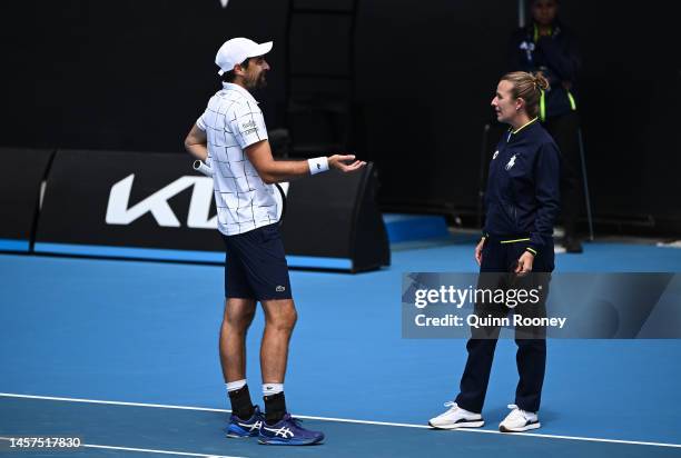 Jeremy Chardy of France speaks to chair umpire Miriam Bley in their round two singles match against Daniel Evans of Great Britain during day four of...