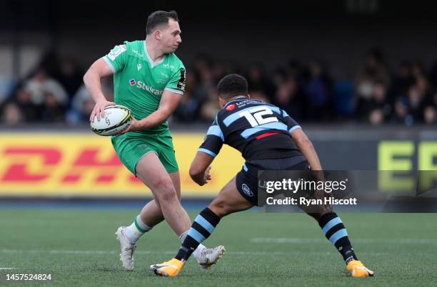 Pete Lucock of Newcastle Falcons is challenged by Ben Thomas of Cardiff Rugby during the European Challenge Cup Pool A match between Cardiff Rugby...