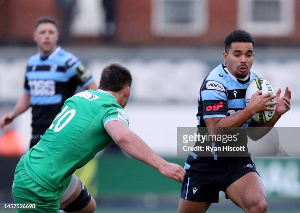 Ben Thomas of Cardiff Rugby is challenged by Pedro Rubiolo of Newcastle Falcons during the European Challenge Cup Pool A match between Cardiff Rugby...