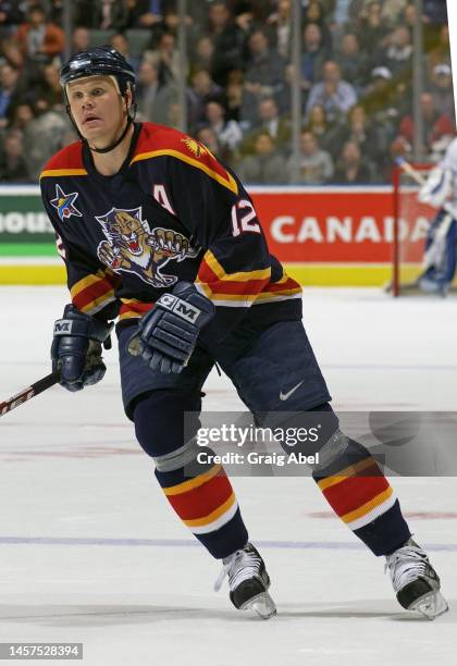 Olli Jokinen of the Florida Panthers skates against the Toronto Maple Leafs during NHL game action on October 23, 2002 at Air Canada Centre in...