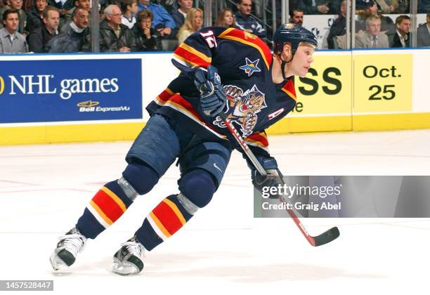 Olli Jokinen of the Florida Panthers skates against the Toronto Maple Leafs during NHL game action on October 23, 2002 at Air Canada Centre in...