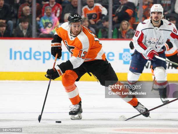 Kevin Hayes of the Philadelphia Flyers skates the puck against Marcus Johansson of the Washington Capitals at the Wells Fargo Center on January 11,...
