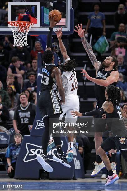 Jaren Jackson Jr. #13 of the Memphis Grizzlies blocks the shot of Darius Garland of the Cleveland Cavaliers during the second half of the game at...