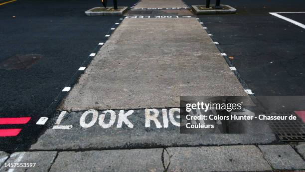 looking right painted at a pedestrian crossing in london - zebra crossing abstract stock pictures, royalty-free photos & images