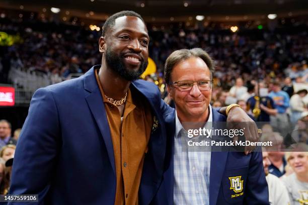 Former NBA and Marquette Golden Eagles player Dwyane Wade poses for a photo with former Marquette head coach Tom Crean at half time during a game...