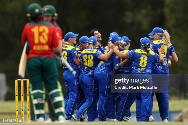 Gabrielle Sutcliffe of the Meteors celebrates victory with team mates after taking the wicket of Clare Scott of the Tigers during the WNCL match...