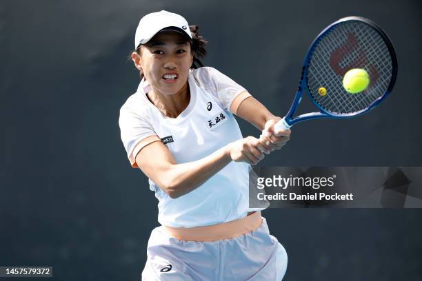 Shuai Zhang of China plays a backhand in their round two singles match against Petra Martic of Croatia during day four of the 2023 Australian Open at...