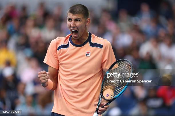 Alexei Popyrin of Australia reacts in their round two singles match against Taylor Fritz of the United States during day four of the 2023 Australian...