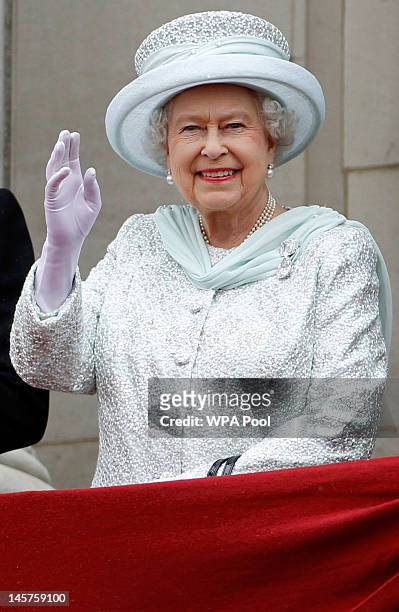 Queen Elizabeth II waves from the balcony of Buckingham Palace during the finale of the Queen's Diamond Jubilee celebrations on June 5, 2012 in...
