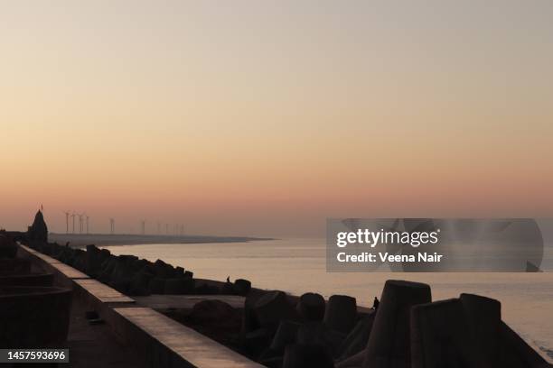 early morning view of dwarka beach near dwarkadhish temple/gujarat/india - gujarat stock pictures, royalty-free photos & images