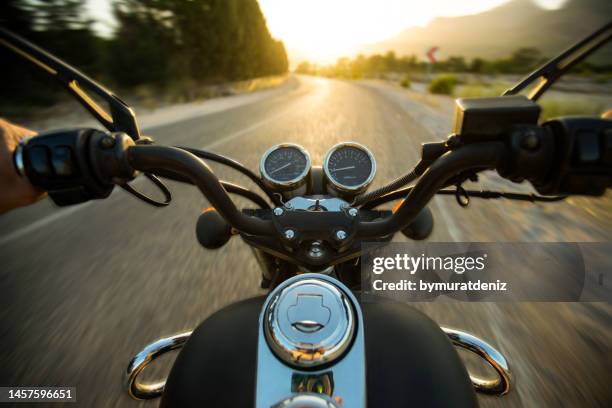 traveling on a motorcycle on the roads - biker stockfoto's en -beelden