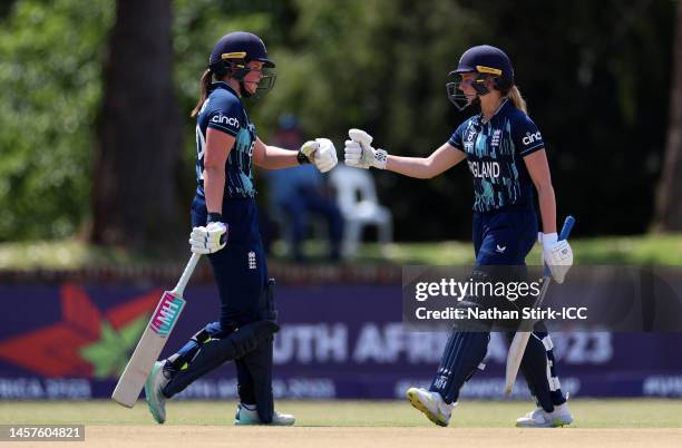 Liberty Heap and Grace Scrivens of England look on during the ICC Women's U19 T20 World Cup 2023 match between England and Rwanda at North-West...