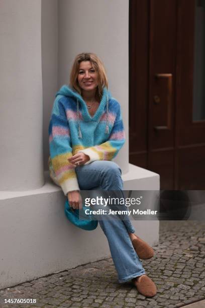 Yasmin von Schlieffen-Nannen seen wearing Max Mara fluffy brown shoes, Celine colorful cashmere sweater, Bottega Veneta blue mini Jodie bag and Nili...