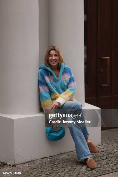 Yasmin von Schlieffen-Nannen seen wearing Max Mara fluffy brown shoes, Celine colorful cashmere sweater, Bottega Veneta blue mini Jodie bag and Nili...