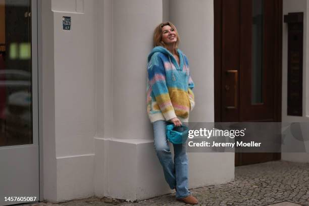 Yasmin von Schlieffen-Nannen seen wearing Max Mara fluffy brown shoes, Celine colorful cashmere sweater, Bottega Veneta blue mini Jodie bag and Nili...