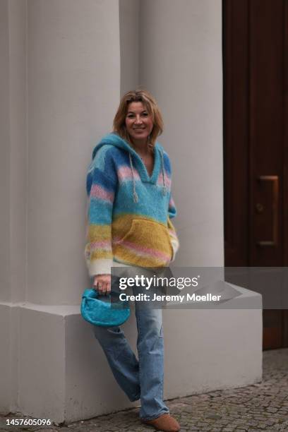 Yasmin von Schlieffen-Nannen seen wearing Max Mara fluffy brown shoes, Celine colorful cashmere sweater, Bottega Veneta blue mini Jodie bag and Nili...