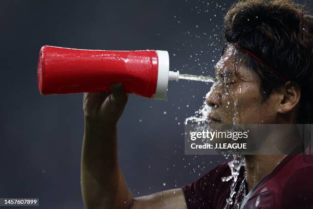 Yoshito Okubo of Vissel Kobe pours water during the J.League J1 match between Vissel Kobe and Gamba Osaka at Home's Stadium Kobe on July 28, 2012 in...