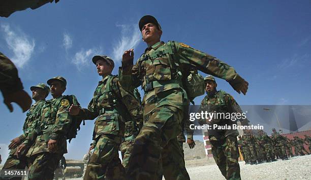 Members of the 3rd Battalion of the Afghan National Army march past the reviewing stand during a graduation ceremony October 3, 2002 in Kabul,...