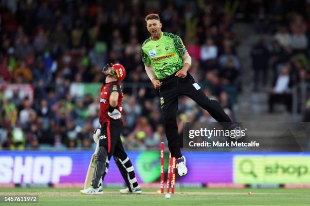 Daniel Sams of the Thunder celebrates taking the wicket of Martin Guptill of the Renegades during the Men's Big Bash League match between the Sydney...