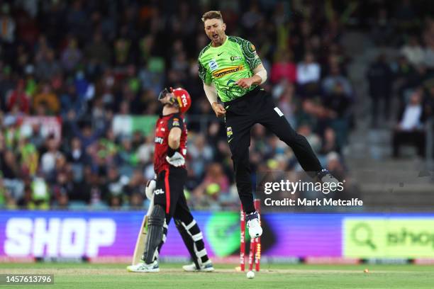 Daniel Sams of the Thunder celebrates taking the wicket of Martin Guptill of the Renegades during the Men's Big Bash League match between the Sydney...