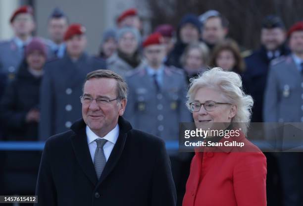 New German Defence Minister Boris Pistorius and outgoing Defence Minister Christine Lambrecht arrive to review a guard of honour at the Defence...