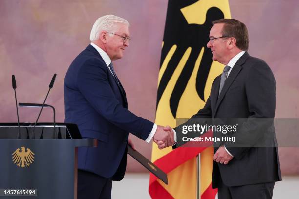German President Frank-Walter Steinmeier hands incoming German defence minister Boris Pistorius his appointment document at a brief ceremony at...