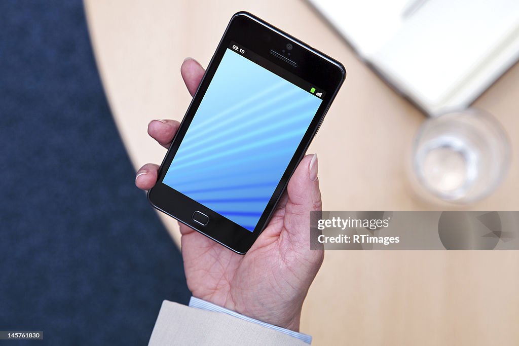 Businesswoman holding a smartphone