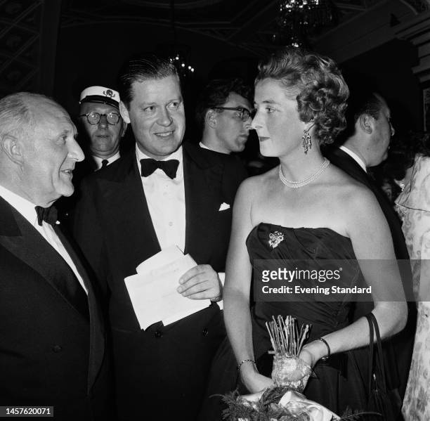 John Spencer, 8th Earl Spencer , and his wife Frances Shand Kydd attending the premiere of the film 'Let's Make Love' in London on August 30th, 1960.