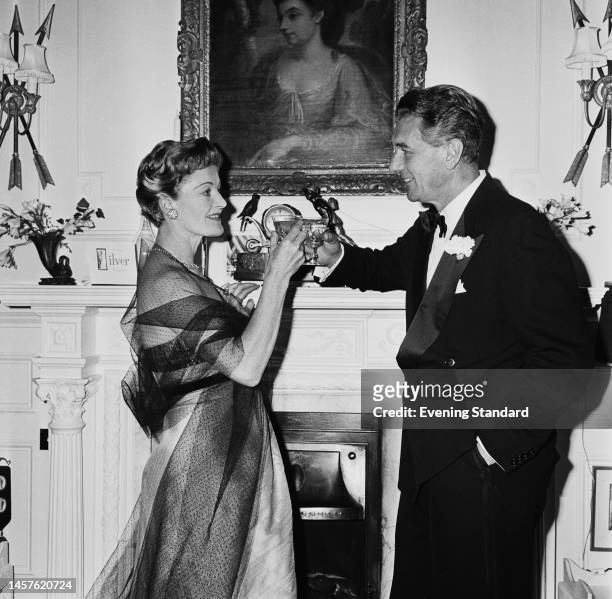 British actors Rachel Kempson and Michael Redgrave celebrating their silver wedding anniversary on July 20th, 1960.