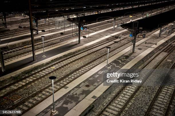 Train tracks lie empty at Gare de l'Est Railway Station in Paris as France is hit by widespread traffic disruption as transport workers join a...