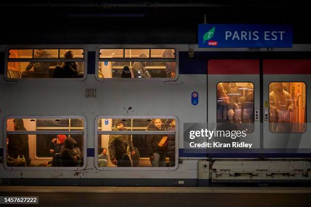 Crowded suburban train arrives at Gare de l'Est Railway Station in Paris as France is hit by widespread traffic disruption with limited services...