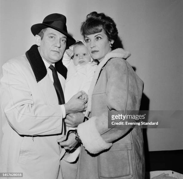 British actor Peter Finch with his actress wife Yolande Turner and their baby daughter on December 6th, 1960.