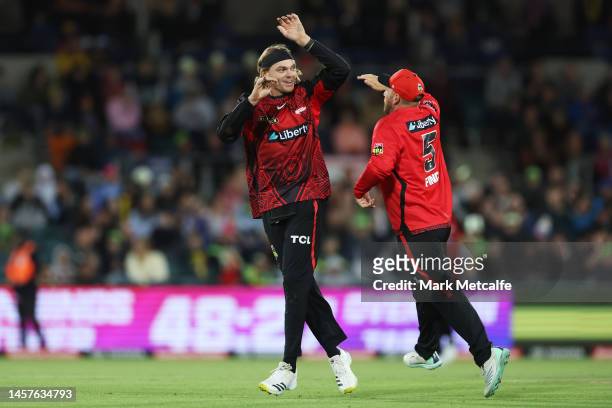 Corey Rocchiccioli of the Renegades celebrates taking the wicket of David Warner of the Thunder during the Men's Big Bash League match between the...